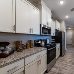 kitchen with white cabinets and granite countertops