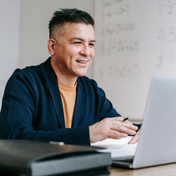 man researching on laptop